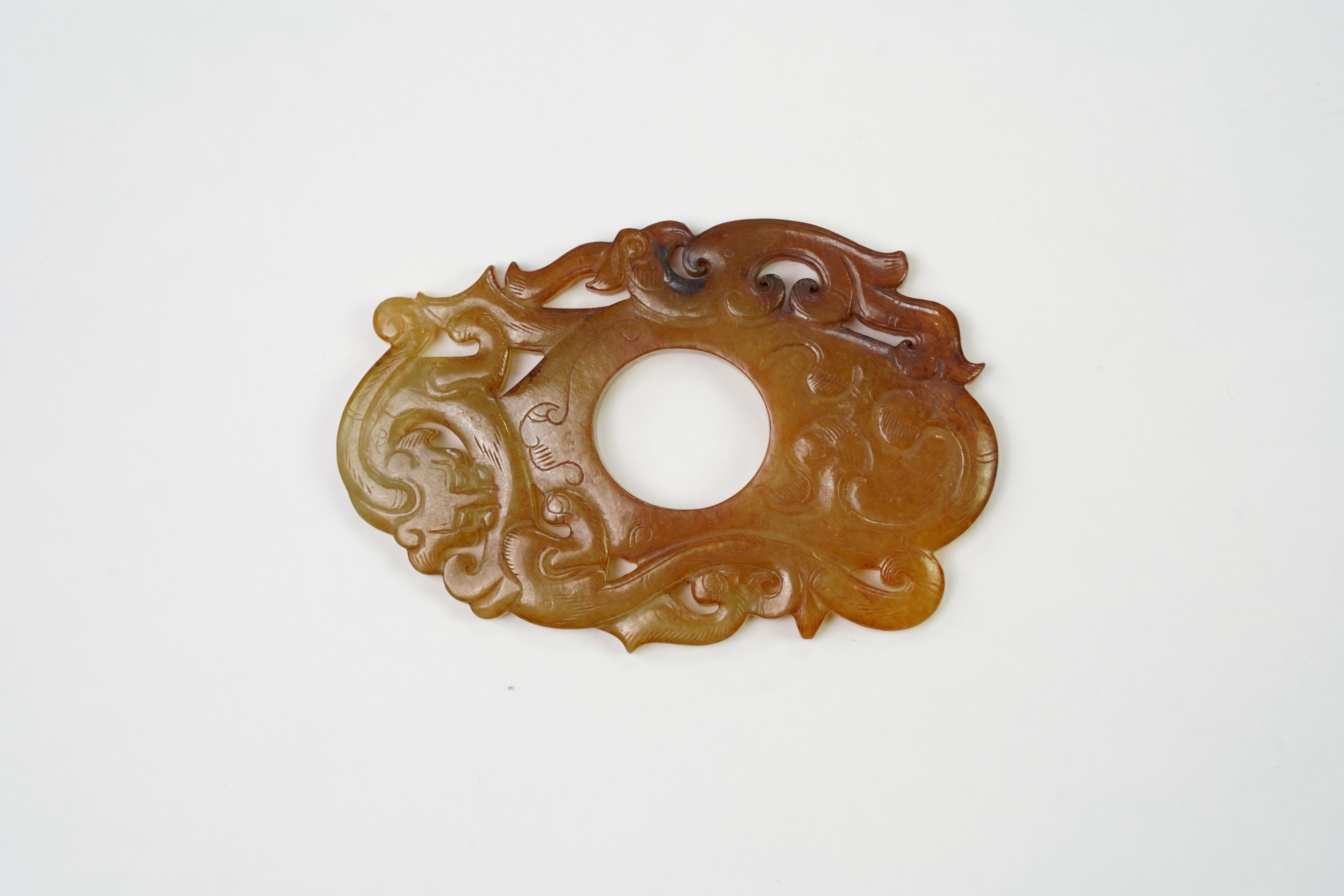 A Chinese archaistic jade plectrum-shaped plaque